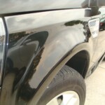 Before and after photographs of a damaged, black, Range Rover that was repaired by Elite Paint & Body Shop in West Palm Beach, FL.